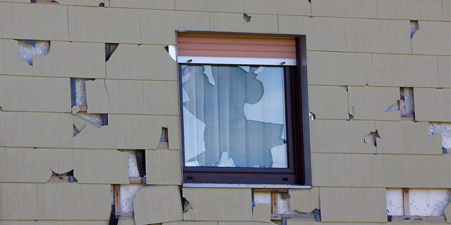Damaged Siding Due To Hail
